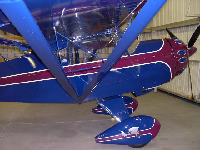 Kitfox in hangar. 
After the Polyspray - silver, I used a Urethane sealer, color and clear from Akzo Nobel, Sikkens. All Sikkens paint had a flex additive.