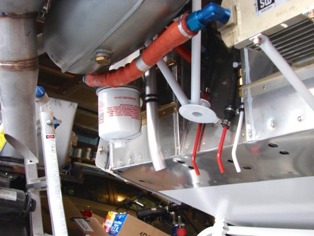 Engine drains, breather outlet tube and oil filter (Rt to Lt). The red drains are ones that should not ever be leaking (fuel pump and spider manifold) and the white one is OK to drip fuel (the intake manifold drain).