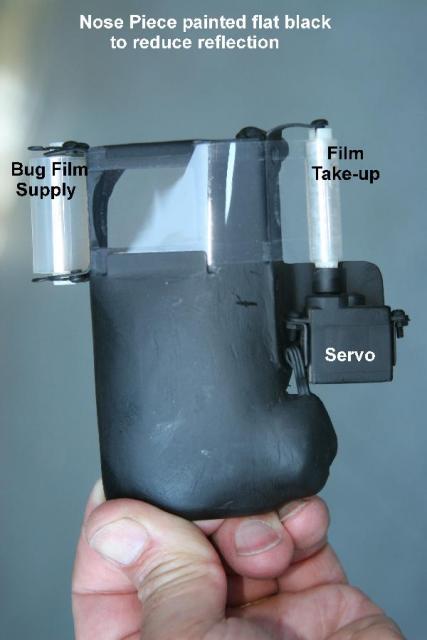 The bug wiper attachment using roll film designed for clearing mud from Motocross racer's goggles