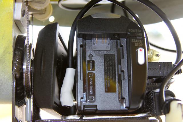 The camera in the mount showing the tight fit for the Video Out HDMI cable and the needed modification on the HDMI plug.